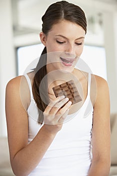 Young Woman Eating Chocolate