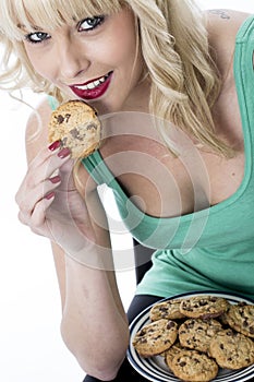 Young Woman Eating a Chocolate Chip Cookie Biscuit