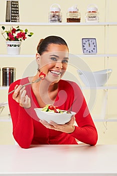 Young woman eating diet salad bowl healthy weight loss food