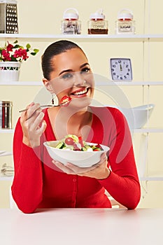 Young woman eating diet salad bowl healthy weight loss food