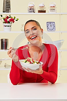 Young woman eating diet salad bowl healthy weight loss food