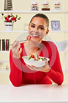 Young woman eating diet salad healthy weight loss food