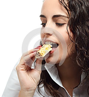 Young woman eating granola bar