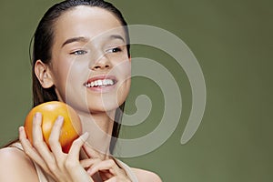 young woman eating grapefruit in hands smile vitamins diet close-up Lifestyle