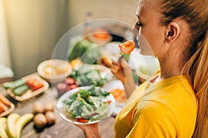 Young woman eating healthy eco food