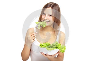 Young woman eating healthy salad