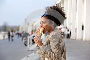 Young woman eating junk food