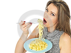 Young Woman Eating Pasta