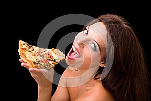 Young woman eating a piece of pizza