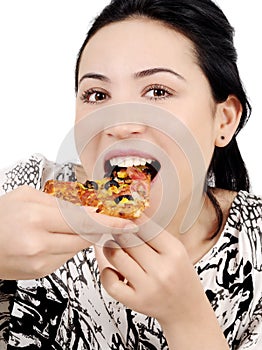 Young woman eating pizza