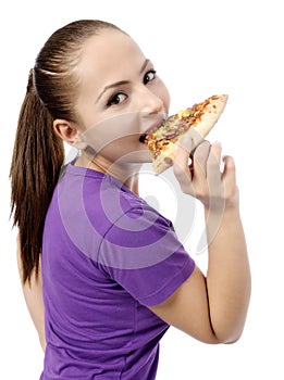 Young woman eating pizza