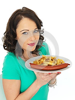 Young Woman Eating Saveloy Sausage and Chips