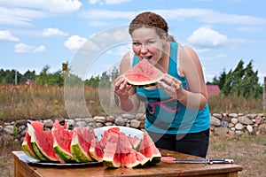 Young woman eating watermelon.