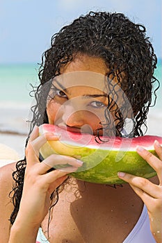 Young woman eating watermelon