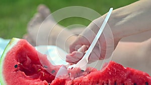 Young woman eating watermelon on the beach. Happiness, rest, beach. Healthy lifestyle.