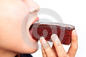 Young woman eatting is brownie photo