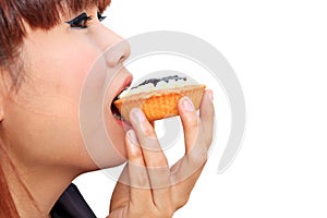 Young woman eatting is pie blueberry