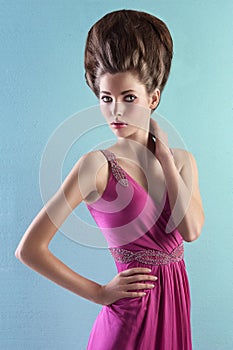 Young woman in elegant pink dress