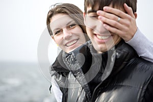 Young woman embracing her boyfriend