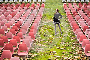 Young woman in empty auditorium