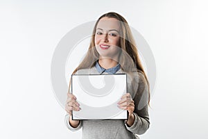 Young woman with an empty plate or frame