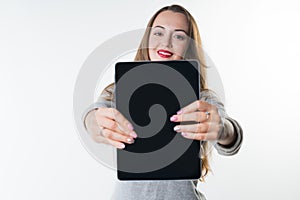 Young woman with an empty tablet screen