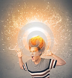 Young woman with energetic exploding red hair