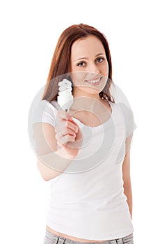 Young woman with energy efficient lightbulb.