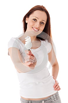 Young woman with energy efficient lightbulb.