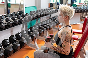 A young woman is engaged in fitness at the GYM.