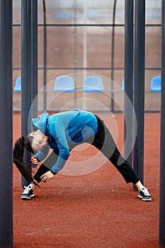 A young woman is engaged in sports on the Playground