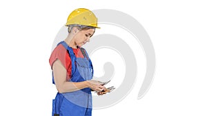 Young woman engineer or architect holding banknotes euros salary on white background.