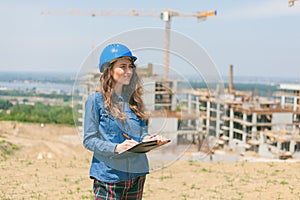 young woman engineer working in construction site