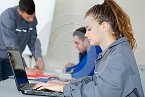 Young woman engineer working on robotics project