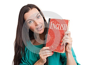 Young woman with an English textbook