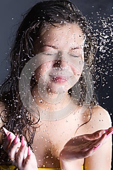 Young woman enjoy in water splashes