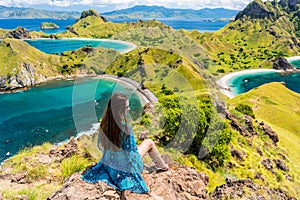 Young woman enjoying the awesome view of Padar Island during sum photo