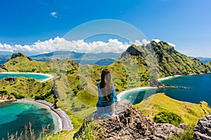 Young woman enjoying the awesome view of Padar Island during sum photo