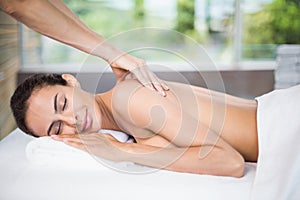 Young woman enjoying back massage