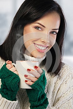 Young woman enjoying a cup of coffee