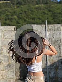 Young woman enjoying freedom, youth, summer heat