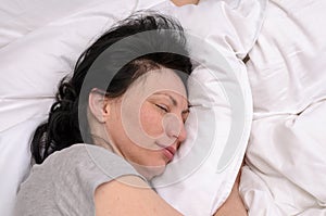 Young woman enjoying a good restful sleep photo