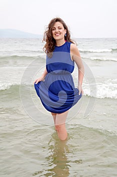 Young woman enjoying her walk on the seaside