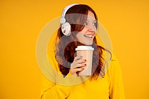 Young woman enjoying listening music with headphones.