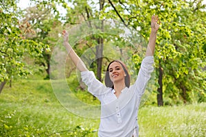 Young woman enjoying nature in a park