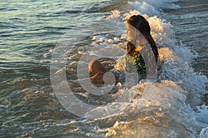 Young Woman Enjoying Ocean Waves