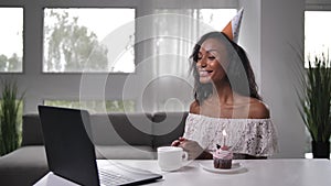 Young woman enjoying online birthday celebration