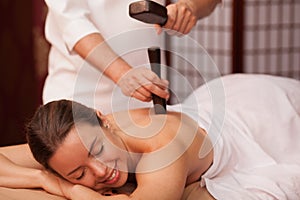 Young woman enjoying professional thai massage