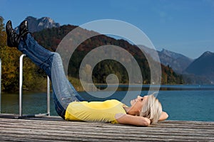 Young woman enjoying a relaxing day at the lake