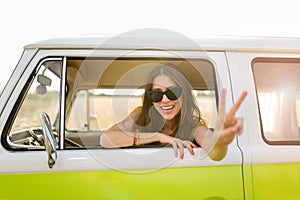 Young woman enjoying a road trip